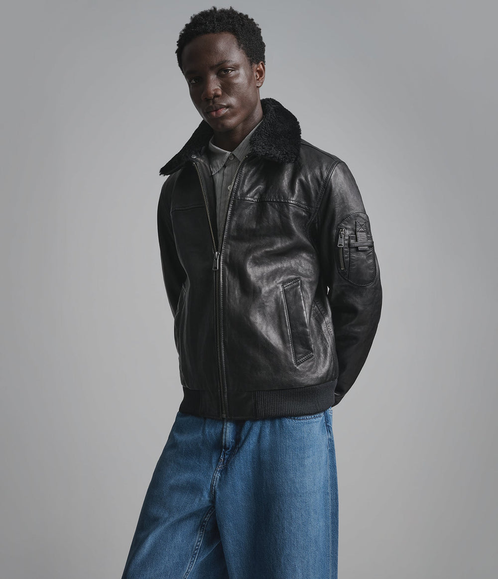 Kingsley black leather bomber jacket with shearling collar, side view — OX & ARMOUR